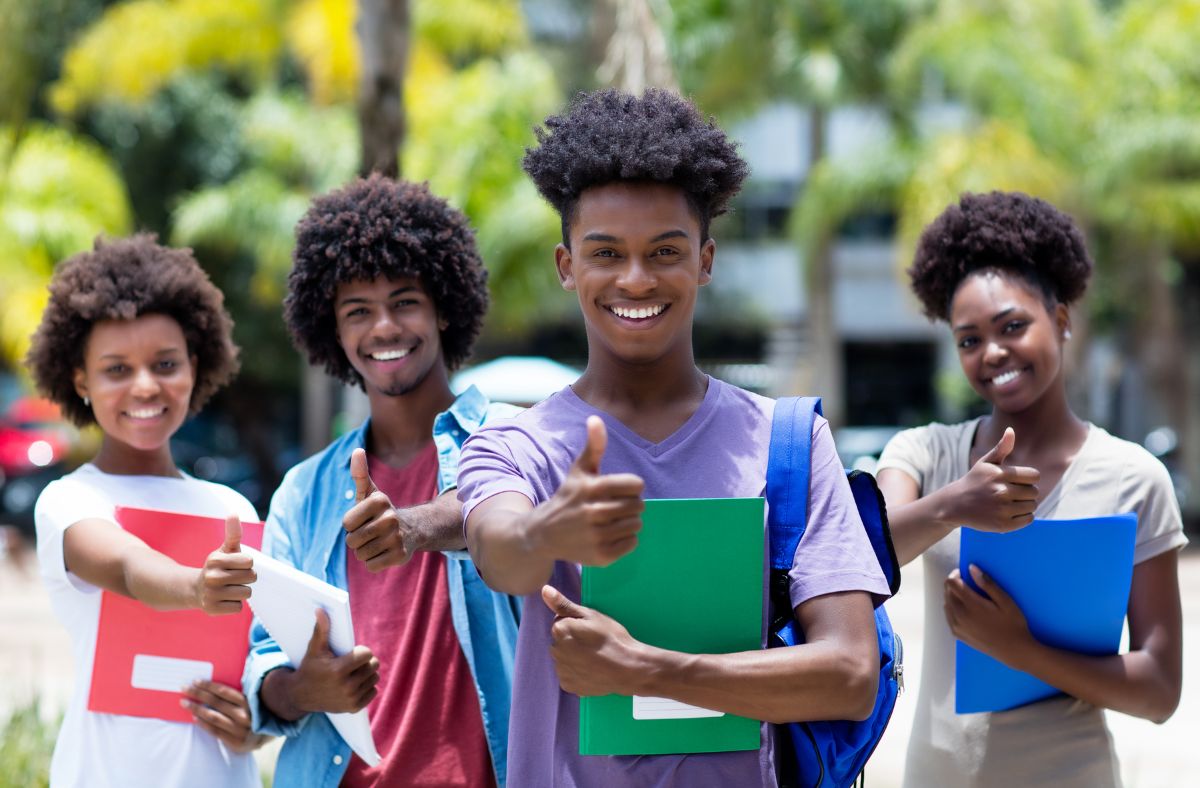 Africans with afro smiling with books in their hands from Cee Koko Books.
